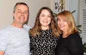 Susie with her husband and daughter